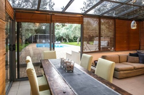 Minimal house with pool and large garden at Varkiza. 5 minutes from the beach!