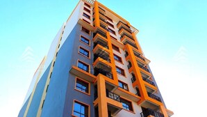 A high-rise building with multiple balconies and windows. - City View Suites (Nairobi)