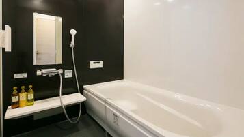 Separate bathtub and shower, free toiletries, hair dryer, slippers