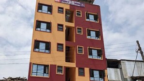 A multi-story building with a sign advertising a bed and breakfast. - Eilarose Suites (Ruiru)