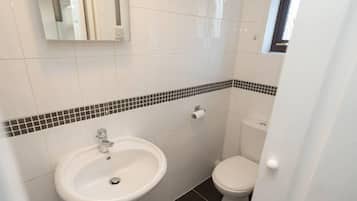 Combined shower/bathtub, deep-soaking bathtub, towels