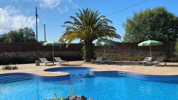 Seasonal outdoor pool, pool umbrellas, pool loungers