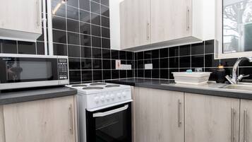 Apartment | Private kitchen | Fridge, microwave, oven, stovetop