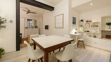 Deluxe Apartment | Living area | 40-inch flat-screen TV with digital channels