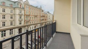 A balcony with a view of historic buildings.