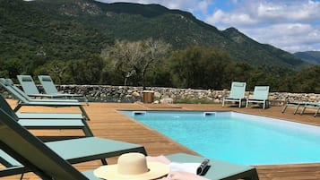 Seasonal outdoor pool, open 10:00 AM to 7:00 PM, sun loungers