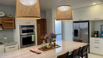 Condo, 5 Bedrooms | Private kitchen | Fridge, oven, coffee/tea maker, toaster