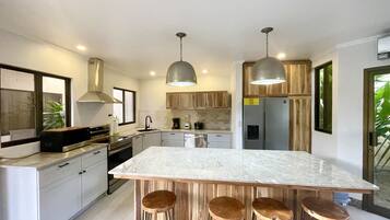 Condo, 4 Bedrooms | Private kitchen | Fridge, oven, coffee/tea maker, toaster