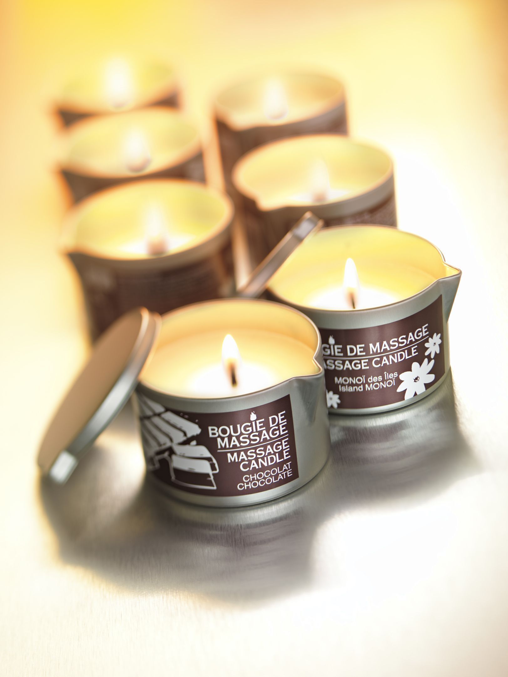 Four massage candles with handles, labeled 'Bougie de Massage' and 'Chocolate'.
