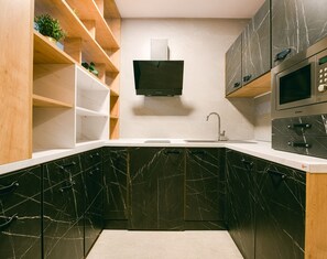 Svarog Unique Apartment by CHORS | Private kitchen | Fridge, microwave, stovetop, electric kettle