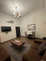 Doppia Comfort | Area soggiorno | TV a schermo piatto, studio
