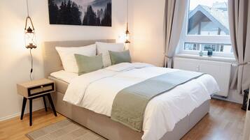 1 bedroom, desk, iron/ironing board, travel crib