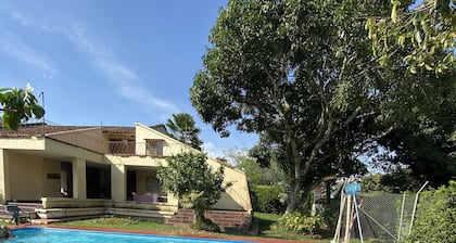 Comfortable and stylish Country Casita with a creek and a pool and lots of trees