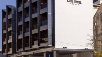 A modern hotel building with a prominent sign reading "LUEL HOTEL".
