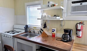 Fridge, microwave, dining tables - Rip Tide! DB4--1 Bedroom/1 Bath Standard Cottage, Walk to the Beach, Dogs OK! (Port Aransas)