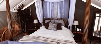 Deluxe Green River Glamping Tent in nature with wood burning oven!