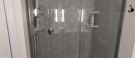 Shower, hair dryer, towels, soap
