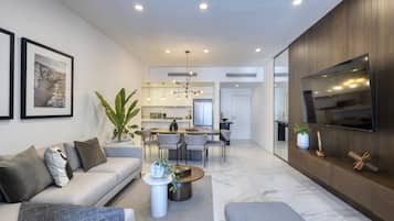 Superior Apartment | Living area | 65-inch Smart TV with digital channels, Netflix, streaming services