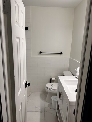 Shower, hair dryer, towels, toilet paper