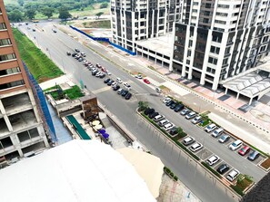 Adjacent to a high-rise building, this parking area offers convenient access to the property.