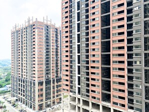 Stylish high-rise building with modern design and balconies.