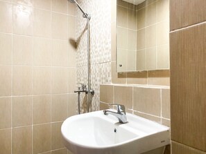 Studio | Bathroom | Shower, free toiletries, towels - Good Choice And Homey Studio Enviro Apartment (Cikarang)