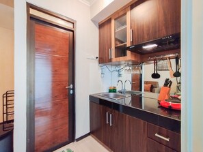 Apartment | Private kitchen | Full-size fridge, stovetop - Contemporary Style 1Br Apartment At Gateway Pasteur (Cimahi)