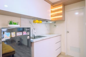 Apartment | Private kitchen | Full-size fridge, stovetop