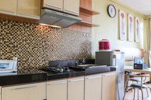 Studio | Private kitchen | Full-sized fridge, stovetop - Spacious Studio The Edge Bandung Apartment (Cimahi)