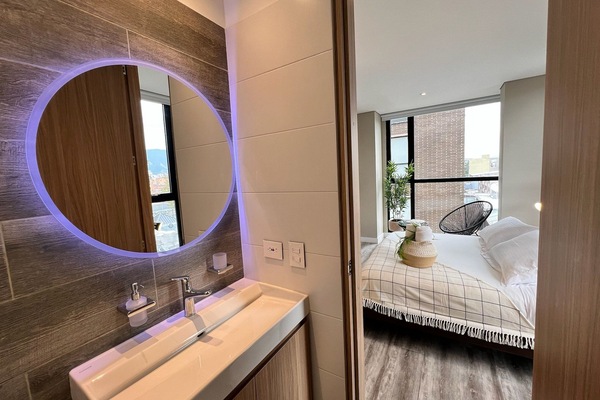 Executive Apartment | Blackout drapes, iron/ironing board, free WiFi