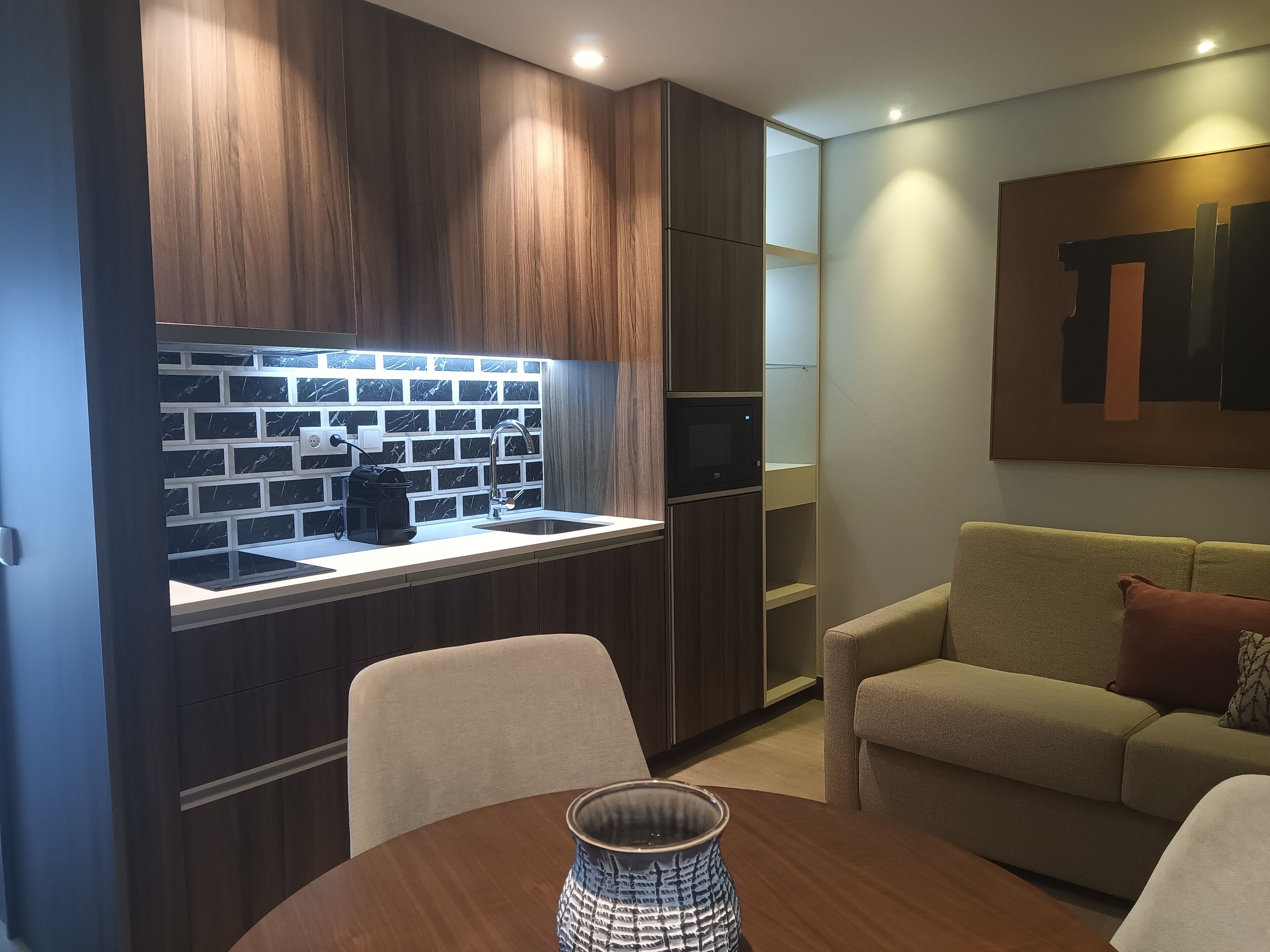 Deluxe Apartment | Living area | 50-inch Smart TV with cable channels