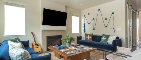 Smart TV, fireplace, table football, books