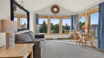Luxury Condo | Living area | 32-inch LED TV with cable channels, DVD player