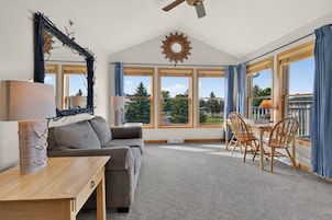 Luxury Condo | Living area | 32-inch LED TV with cable channels, DVD player