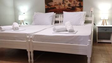 Habitació exclusiva, 2 llits individuals | 1 dormitori, roba de llit d'alta qualitat i caixa forta a l'habitació