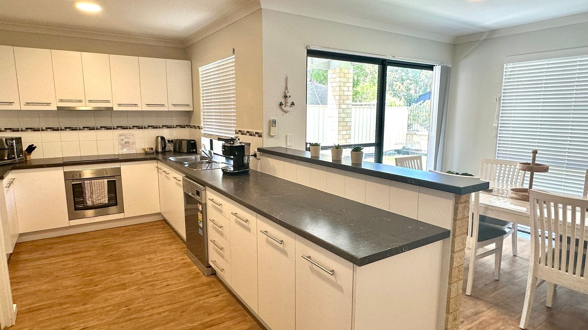 Microwave, oven, dishwasher, dining tables