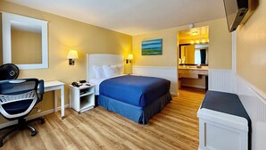 A hotel room with a bed, desk, chair, and a bathroom visible through an open door. - 2 Bedroom PET-FRIENDLY Family Suite at Ocean-Side Property! (Monterey)