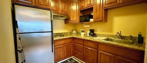 Fridge, microwave, stovetop, coffee/tea maker