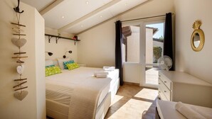 A bedroom with a bed, bedside tables, a dresser, a mirror, and a window with curtains. - 06V - Beautiful villa with spa, pool and tennis (Biot)