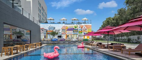 Outdoor pool, open 7:00 AM to 7:00 PM, sun loungers