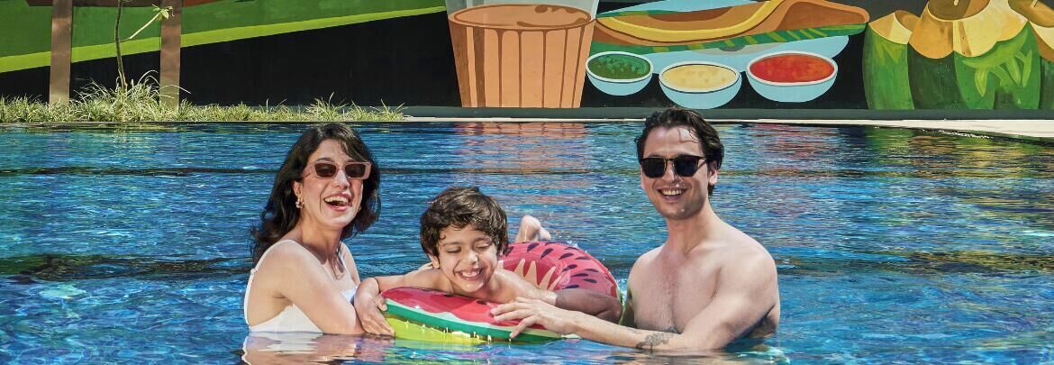 A swimming pool with a mural in the background.