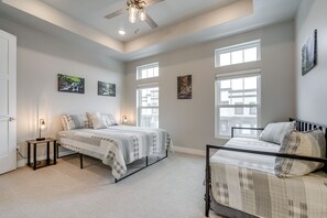 A bedroom with two beds, a ceiling fan, and artwork on the walls. - Stunning Mtn Views! Home 3 Mi to Dtwn Cedar City! (Cedar City)