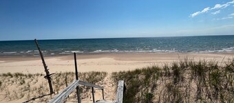 Water's Edge: Endless Summer on Lake Michigan – Book Your Beach Getaway!