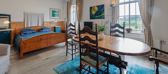 Farmhouse by Lauwers River with Rowing Boat