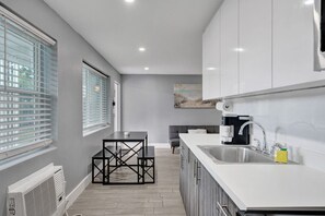 Fridge, microwave, stovetop, coffee/tea maker