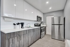 Fridge, microwave, stovetop, coffee/tea maker