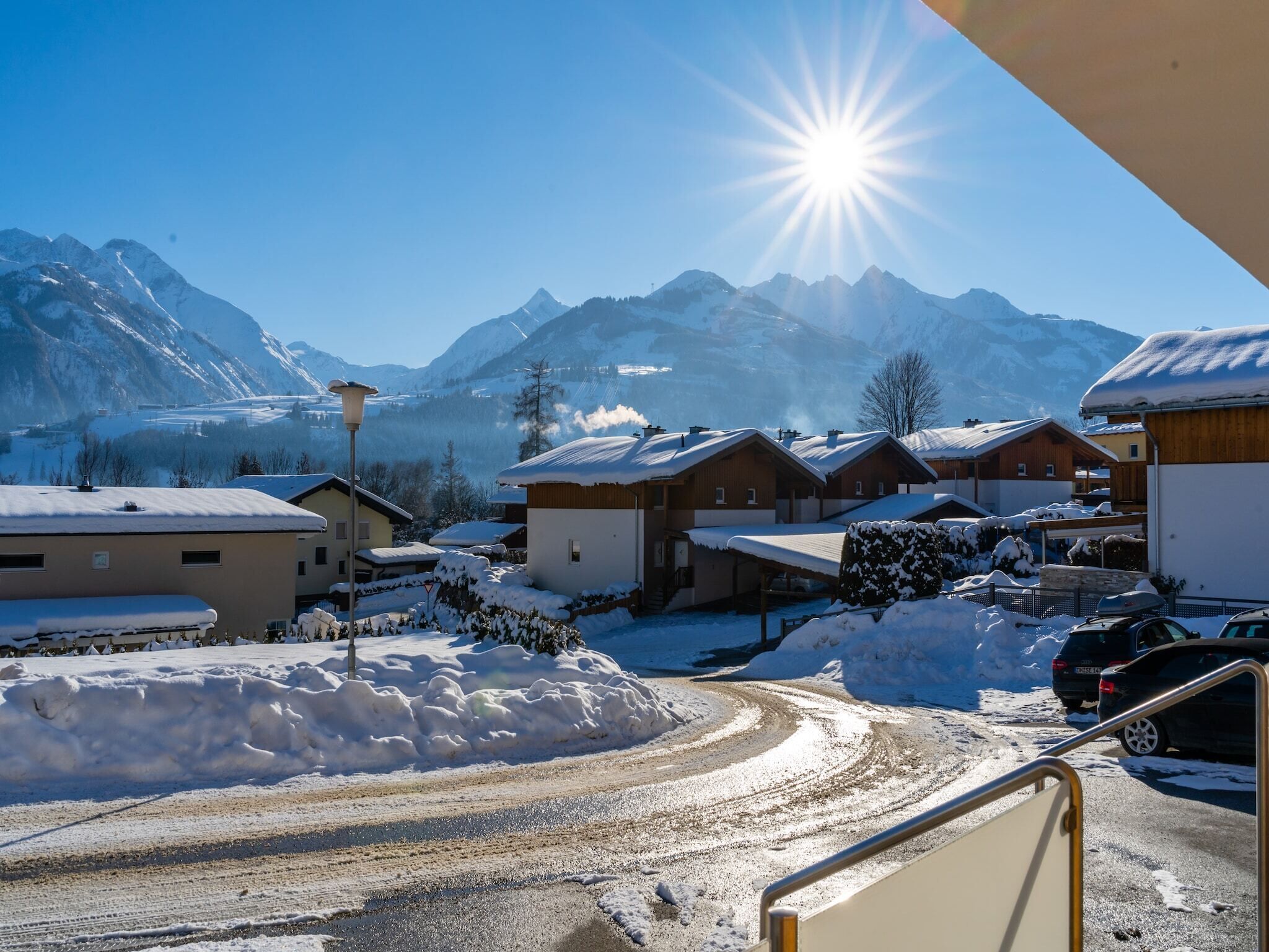 A snowy mountain village with wooden houses and a clear sky.