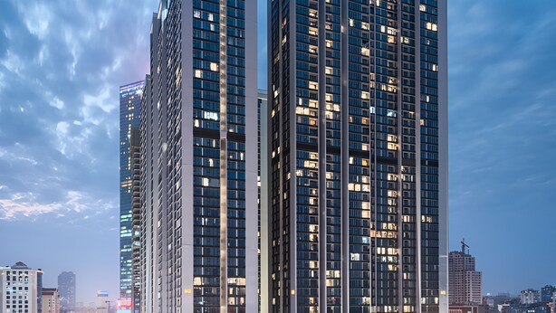 A high-rise building with multiple floors, large windows, and a modern architectural design. - Vinhomes Metropolis Ha Noi-Gem Apartment (Hanoi)