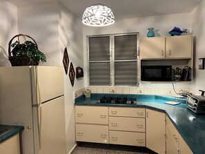 Fridge, microwave, stovetop, coffee/tea maker