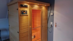 A wooden sauna with a control panel and a door. - Coastal Getaway w/ Sauna (Scherpenisse)